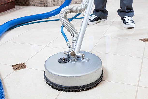Home cleaning showing professional tile and grout deep cleaning process